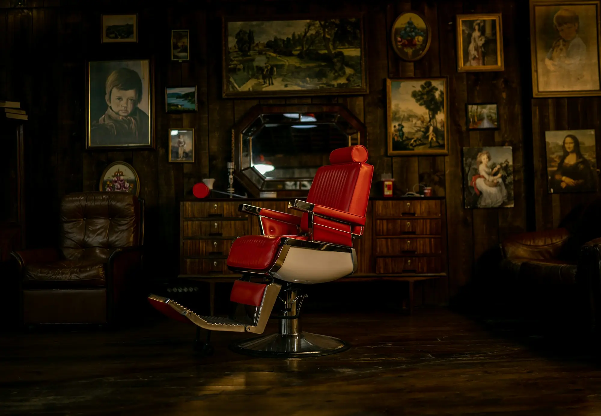 Barber chair in a shop full of framed pictures